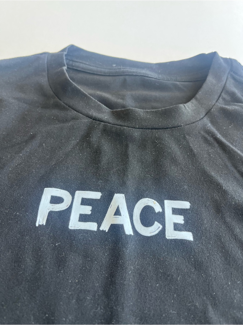 Women's Black Long Sleeve 'PEACE' Graphic Tee